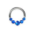 Anneau titane avec 4petit et 1 grand zircon bleue