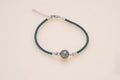 Bracelet perle ovale sur coton soyeux et argent