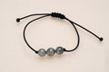 Bracelet 3 perles sur cordon noir polyester