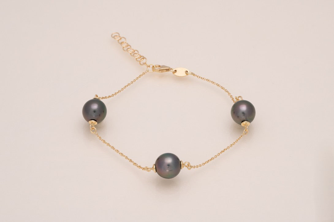Bracelet en or avec 3 perles ovales