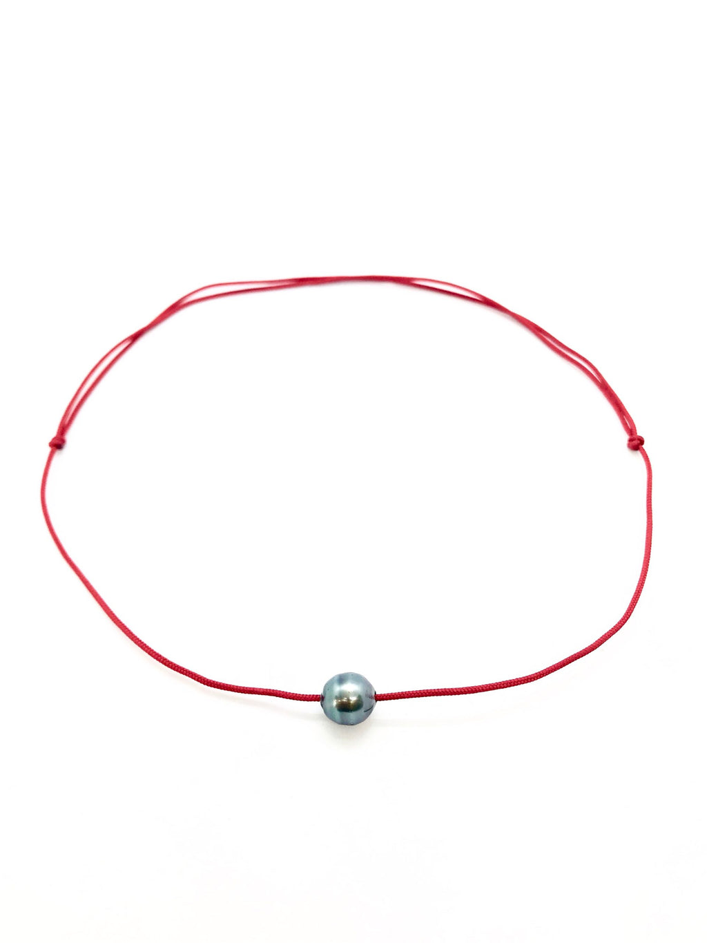 Collier perle cerclée sur cordon