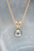 Pendentif or et perle ronde